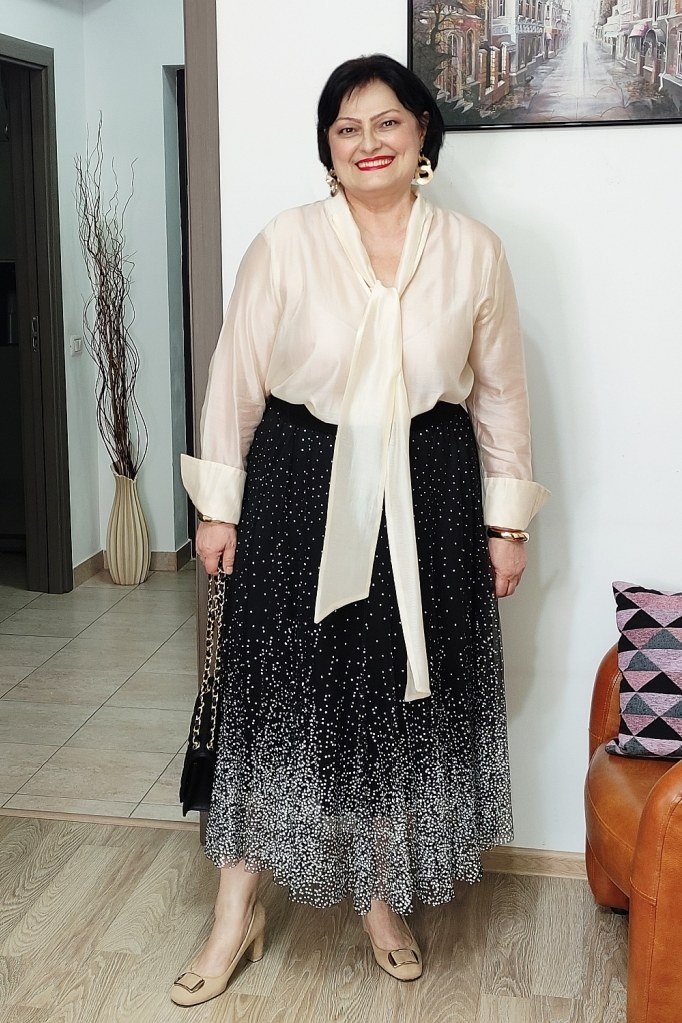 champagne tie neck blouse with black sequin midi skirt