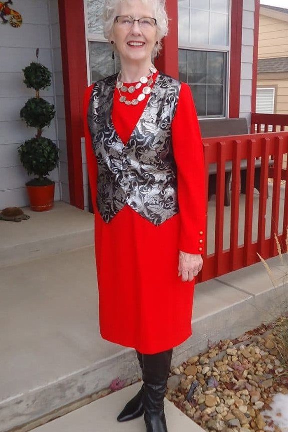 Red Sheath Dress with a Silver Embroidered Vest worn by older woman, red sheath dress with silver embroidered vest on porch