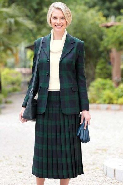green blazer with green pleated tartan skirt holiday outfit