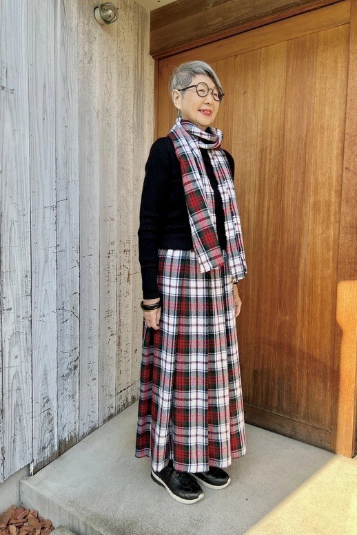 black top with red tartan maxi skirt and cozy scarf