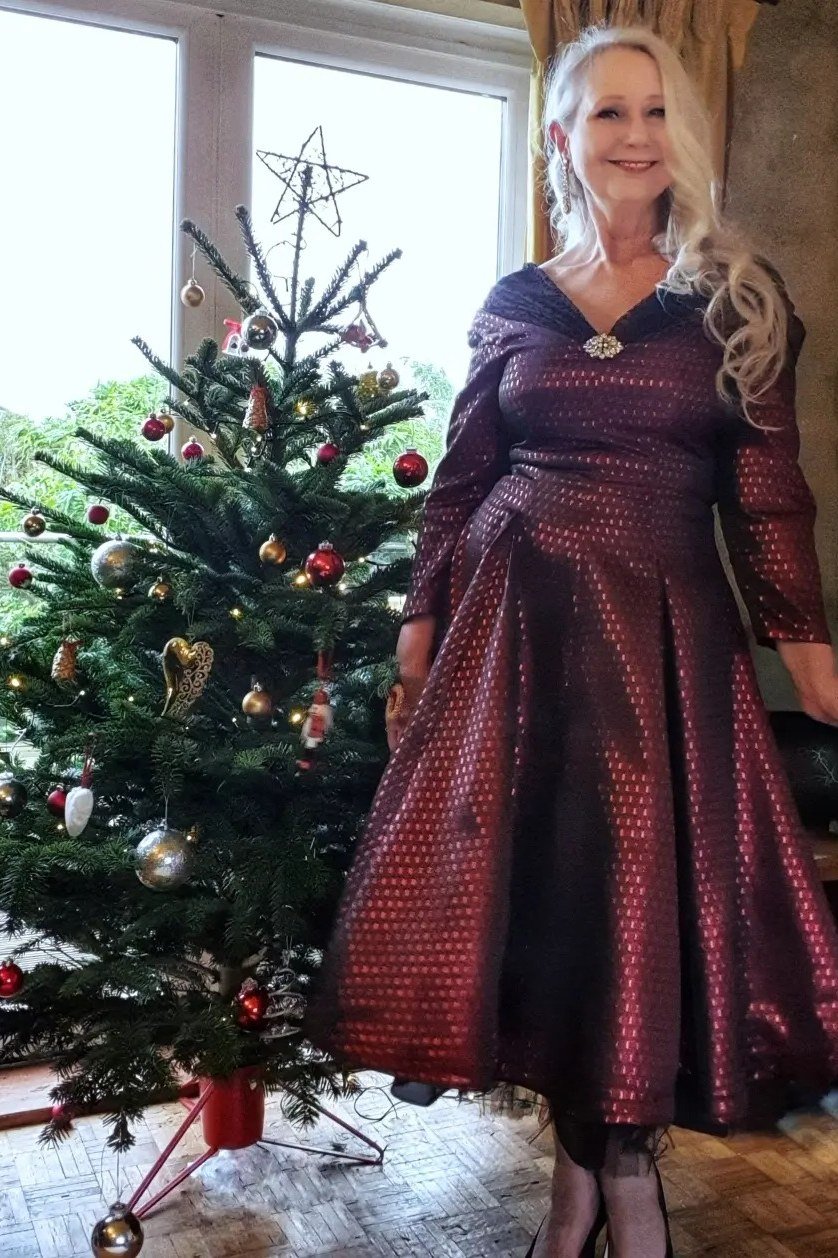 Burgundy Brocade Dress with Sleeves worn by older woman, burgundy brocade dress with sleeves by Christmas tree