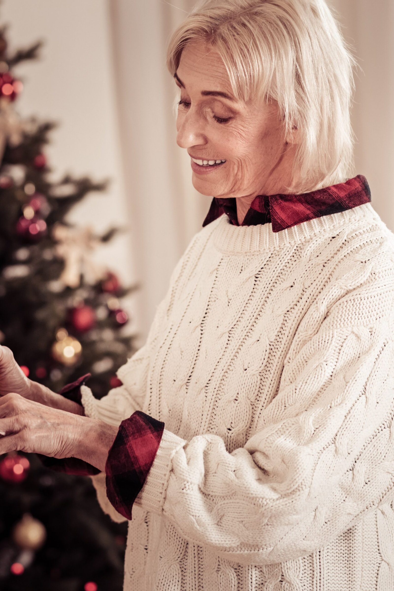 cream cable knit with buffalo check scarf by christmas tree