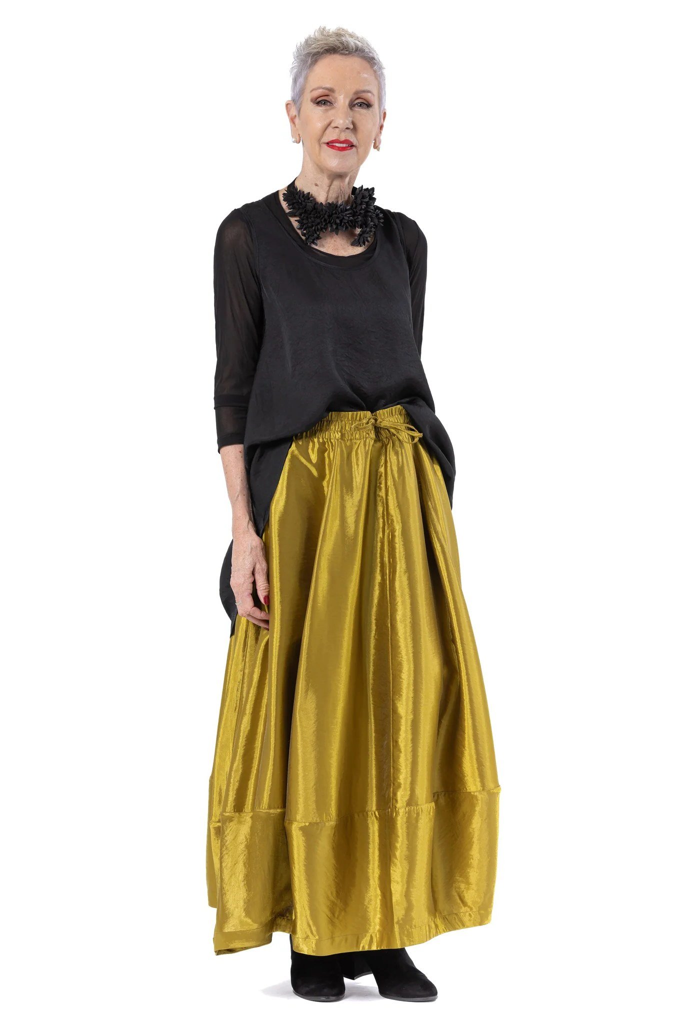 purple sweater with gold skirt outdoors at christmas