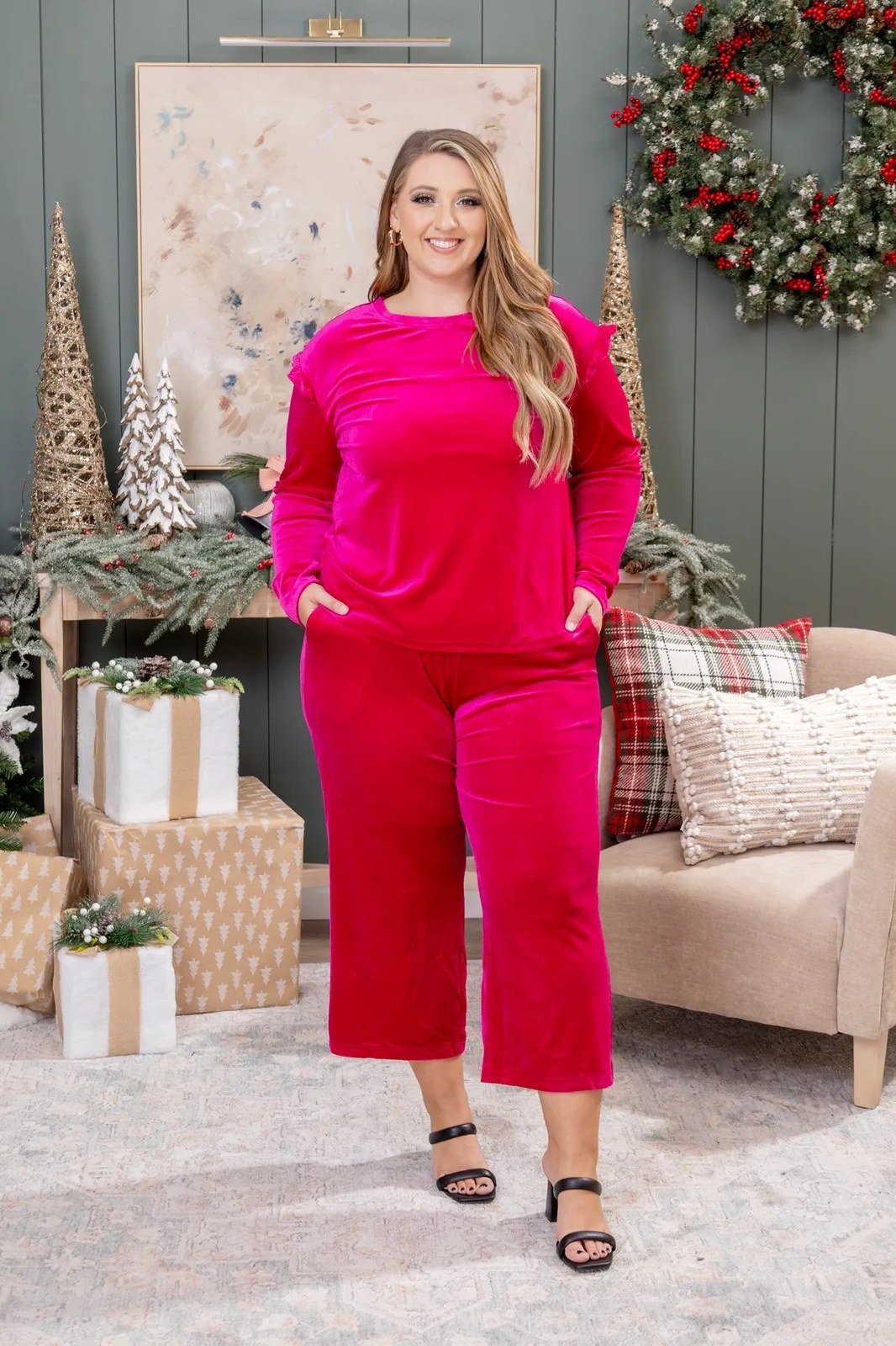 Fuchsia velvet wide-leg Christmas jumpsuit with holiday decor, bold party outfit for women over 70