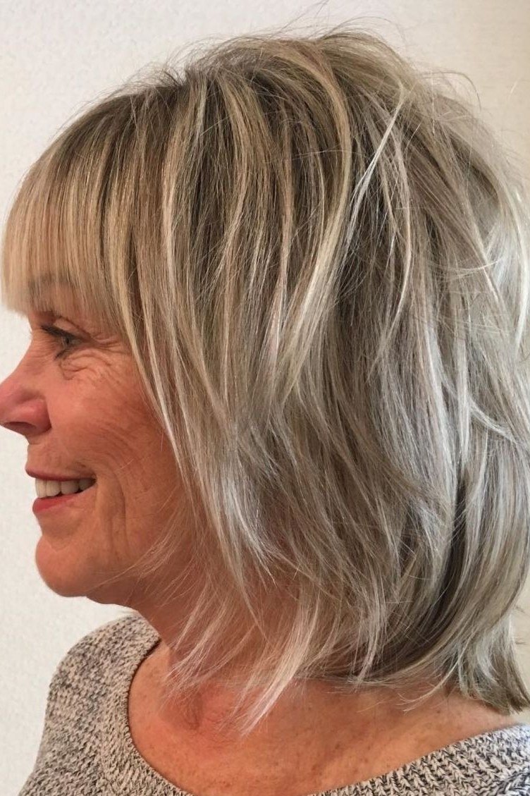 Blonde Layered Cut with Full Bangs for women over 60