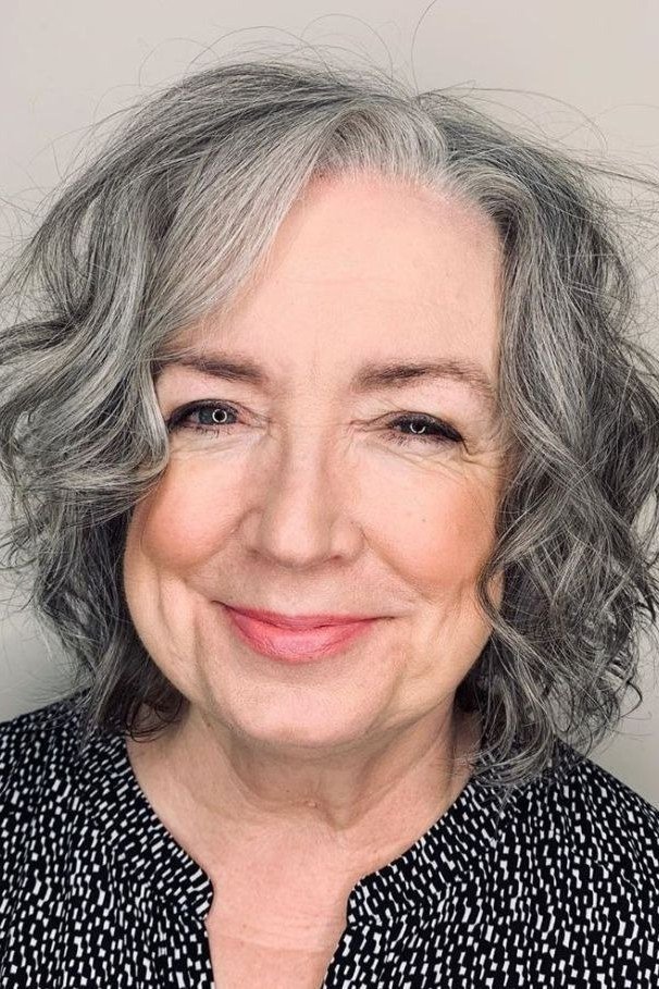 Grey Curly Cut with Face-Framing Curls for women over 60