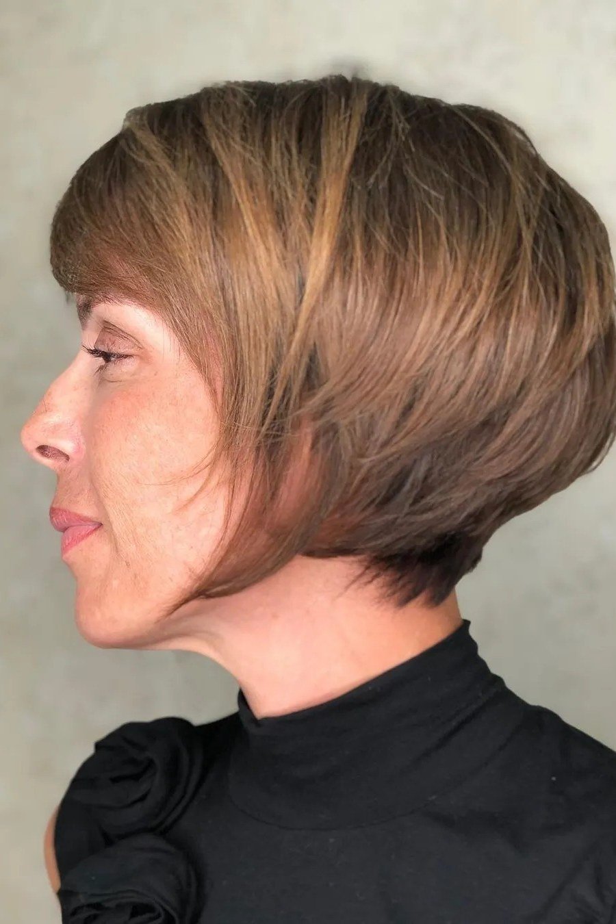 Chin Length Copper Layered Bob - youthful hairstyle for women over 40