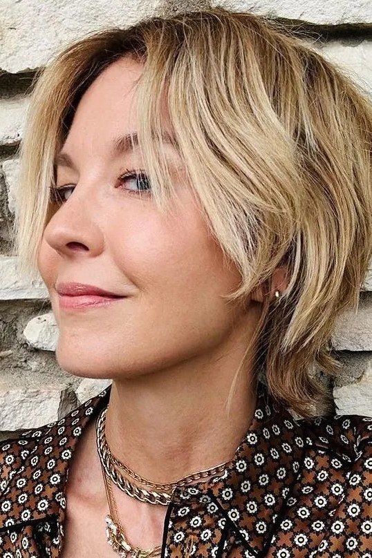 Shoulder Skimming Layered Blonde Bob - youthful hairstyle for women over 40
