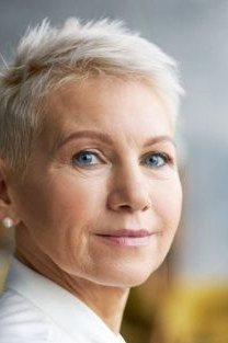 Soft White Textured Pixie with Fringe - youthful hairstyle for women over 40
