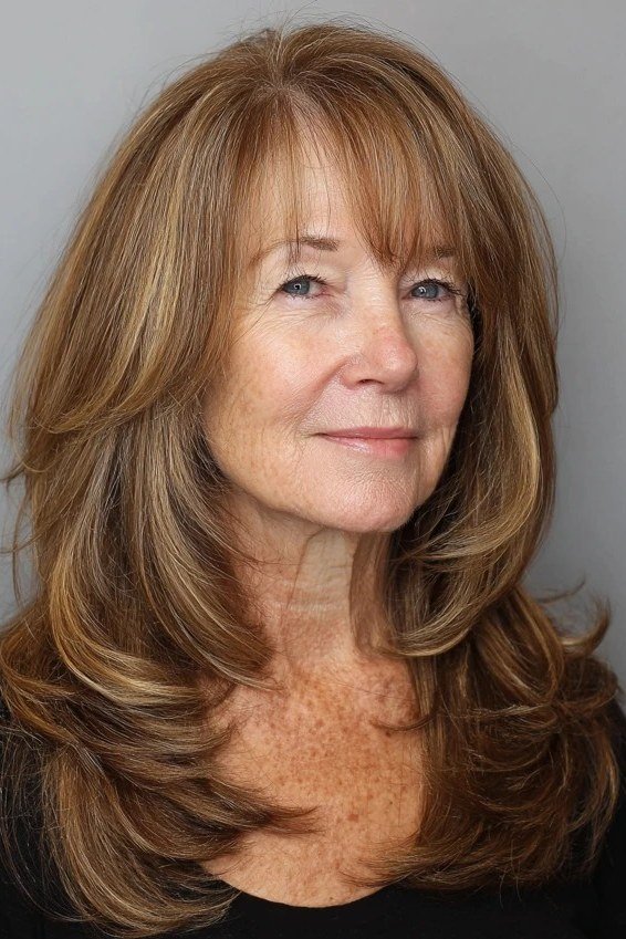 Long Light Brown Layers with Wispy Fringe - youthful hairstyle for women over 40