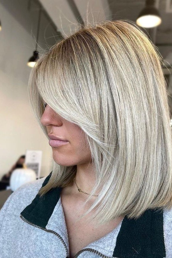 Sleek Silver White Straight Bob - youthful hairstyle for women over 40