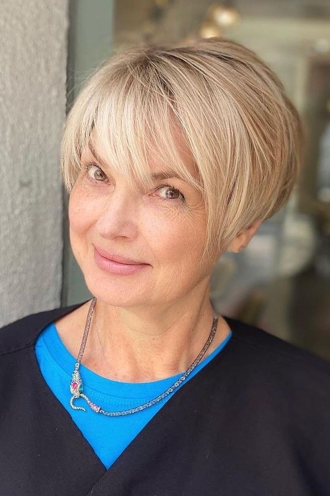 Blonde Pixie with Full Bangs, a short hairstyle for women over 50